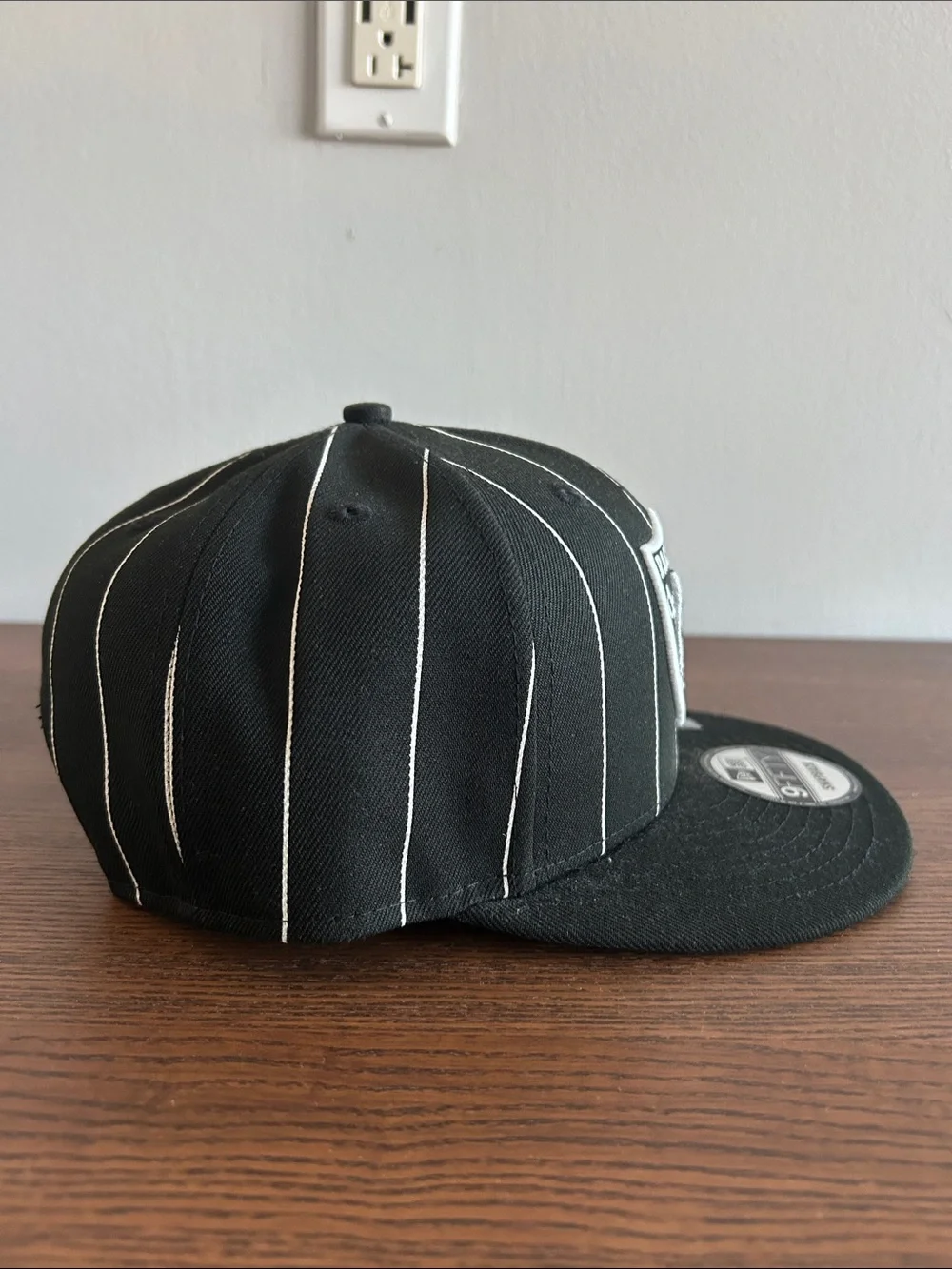 New Era Black & White Raiders Pinstripe Snapback Hat